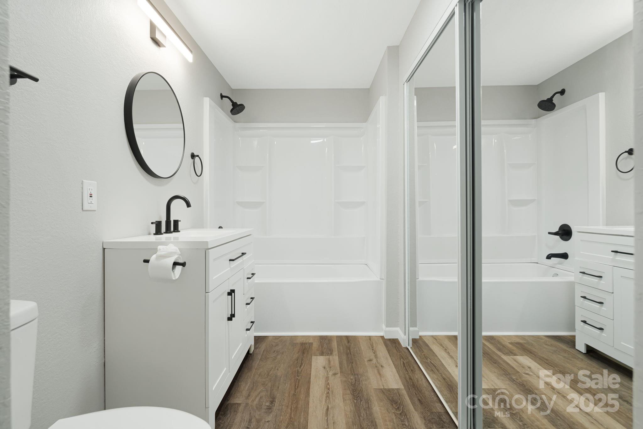 95 Grassy View Road Candler, NC 28715 - Photo 20 of 27 a bathroom with a sink a toilet and shower