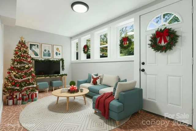 a living room with furniture and a flat screen tv