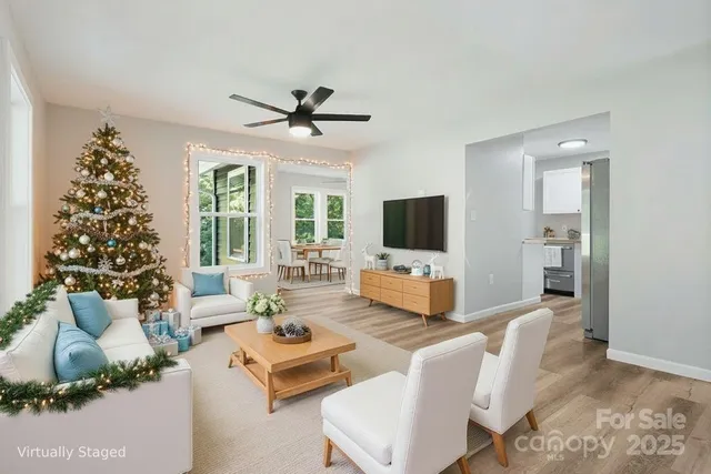 a living room with furniture and a flat screen tv