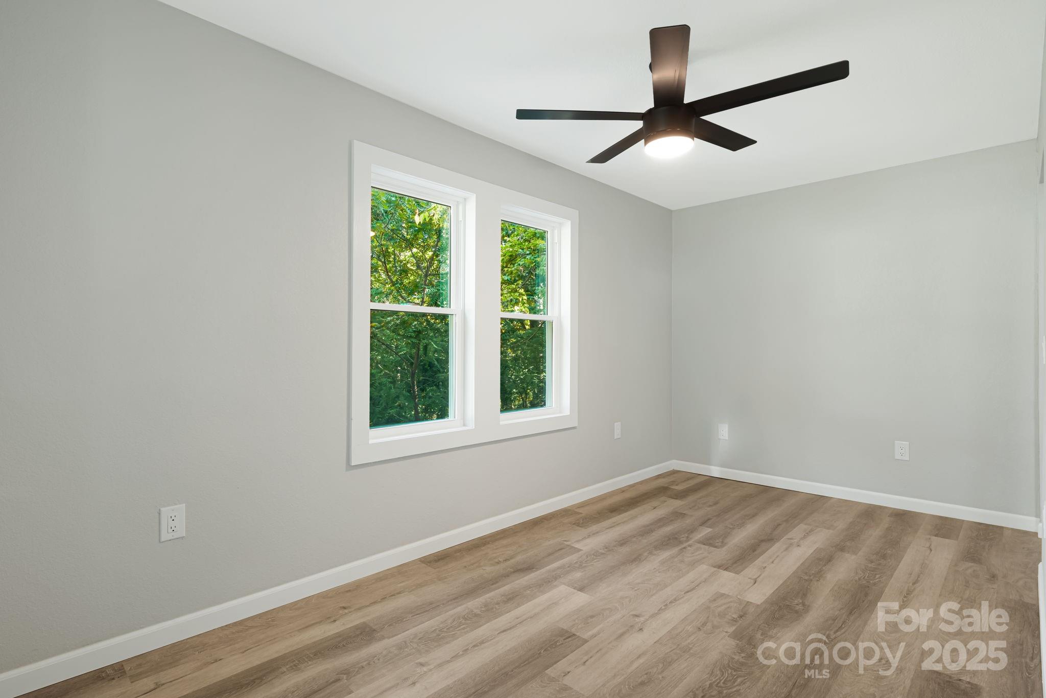 95 Grassy View Road Candler, NC 28715 - Photo 8 of 27 a view of empty room with ceiling fan