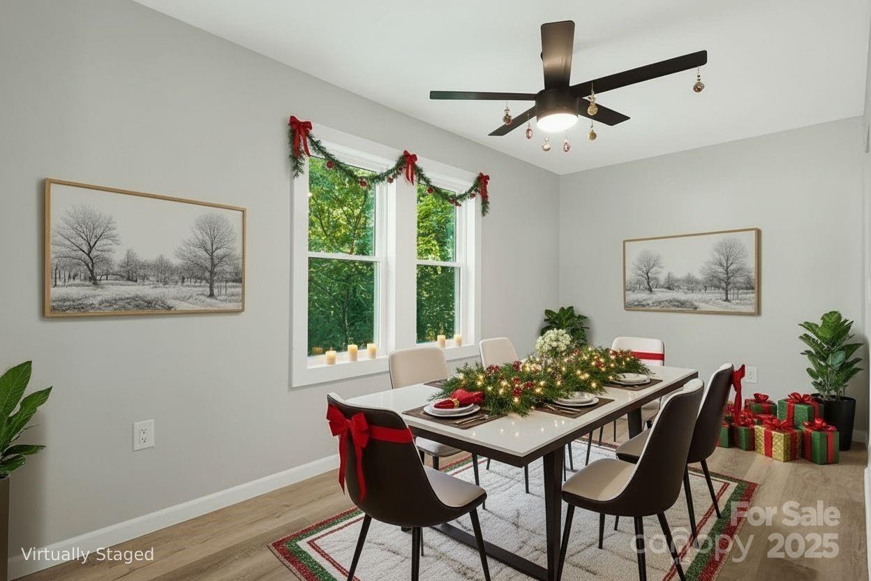 95 Grassy View Road Candler, NC 28715 - Photo 9 of 27 a view of a dining room with furniture window and wooden floor