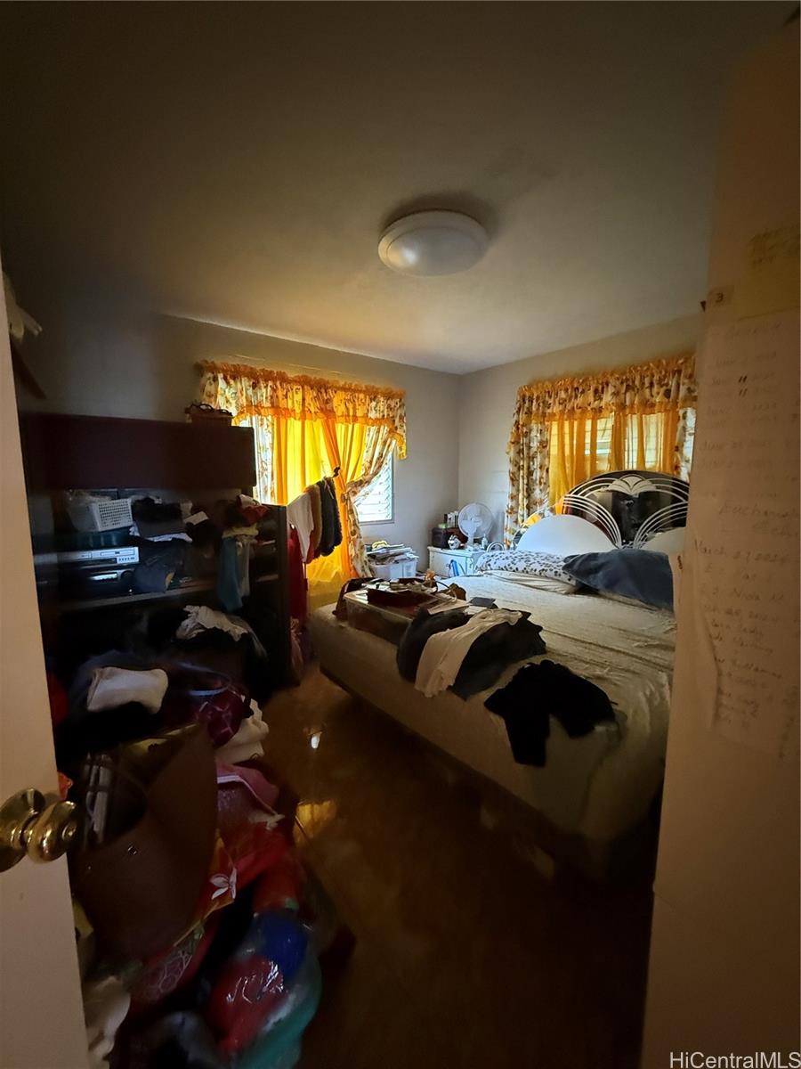 94-571 Ana Aina Place Waipahu, HI 96797 - Photo 13 of 16 a view of a livingroom with furniture and windows