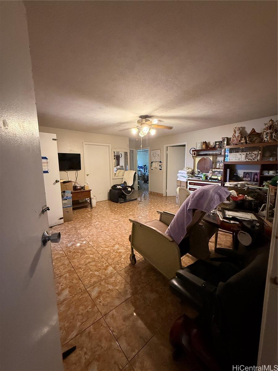 94-571 Ana Aina Place Waipahu, HI 96797 - Photo 14 of 16 a living room with furniture