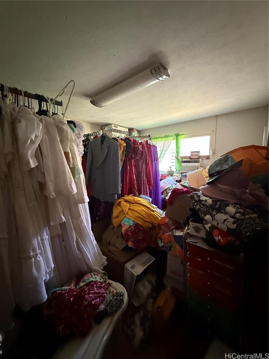 94-571 Ana Aina Place Waipahu, HI 96797 - Photo 4 of 16 a bed room with a bed and a closet