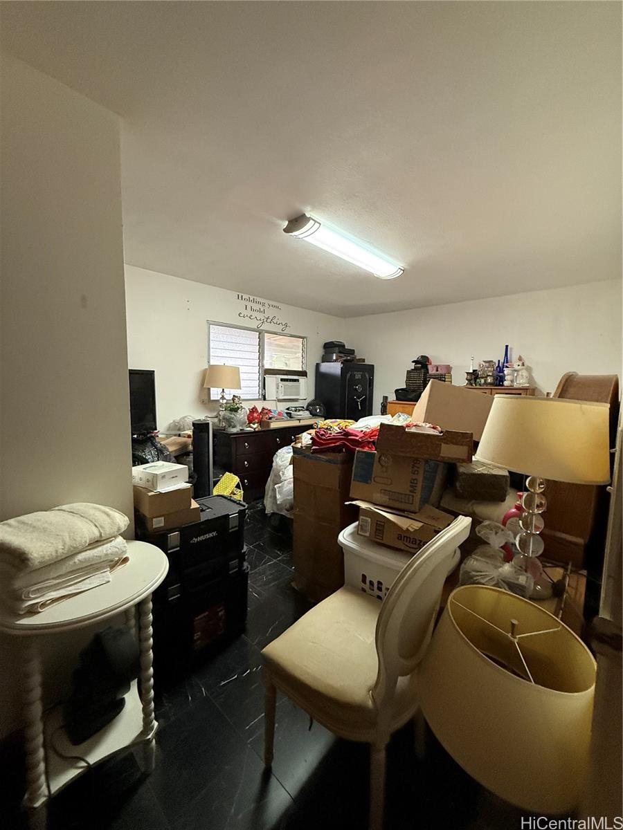 94-571 Ana Aina Place Waipahu, HI 96797 - Photo 5 of 16 a living room with furniture and a fireplace