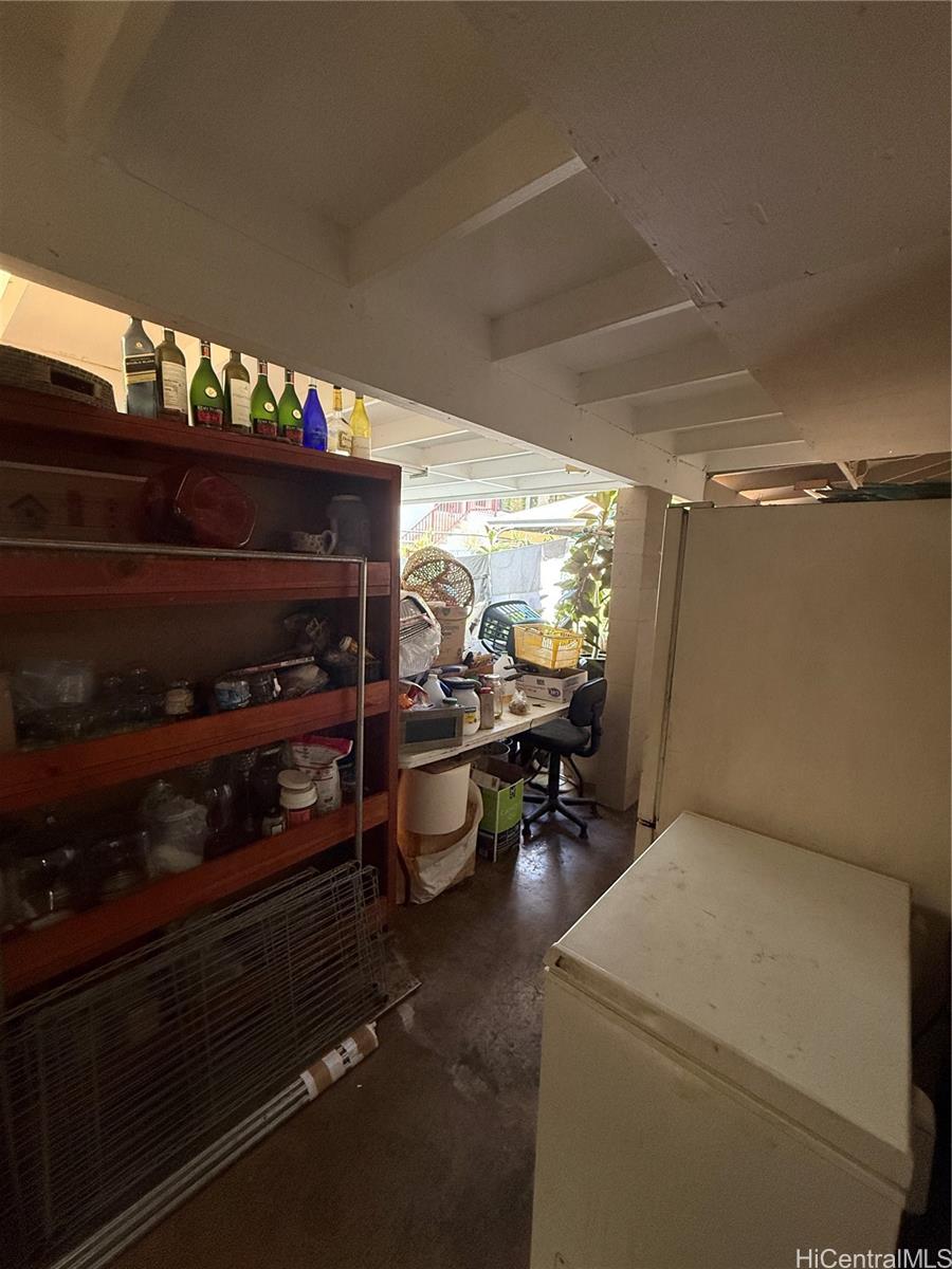 94-571 Ana Aina Place Waipahu, HI 96797 - Photo 9 of 16 a room with furniture and a fireplace