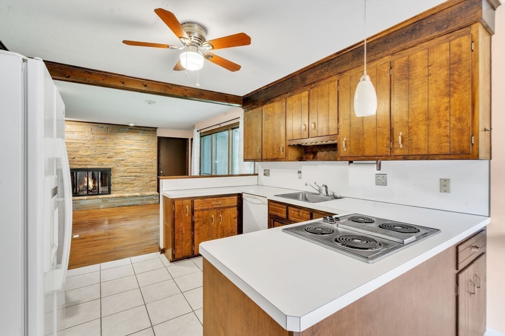 11 Brooks Road Longmeadow, MA 01106 - Photo 11 of 27 a kitchen with a stove a sink and a refrigerator