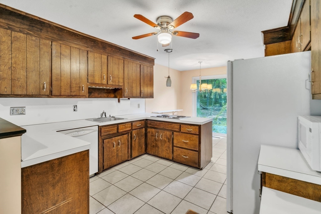 11 Brooks Road Longmeadow, MA 01106 - Photo 13 of 27 a kitchen with a cabinets and white appliances
