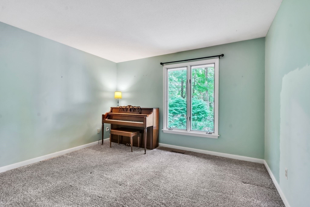 11 Brooks Road Longmeadow, MA 01106 - Photo 20 of 27 a room with a window and a piano