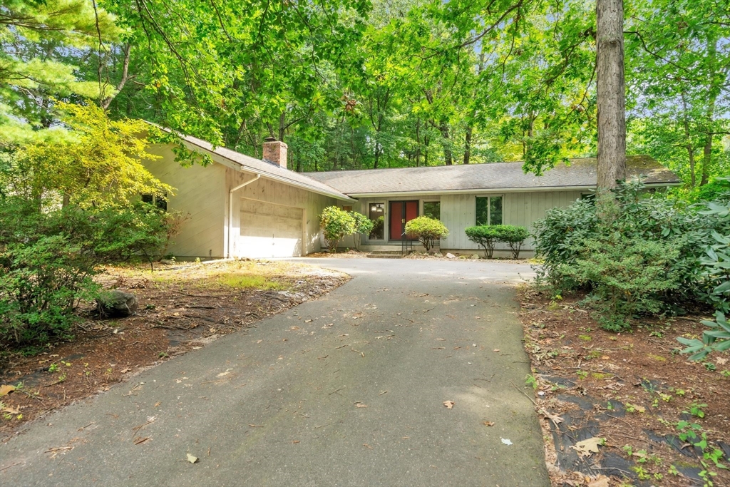 11 Brooks Road Longmeadow, MA 01106 - Photo 2 of 27 a front view of a house with a yard and a garage