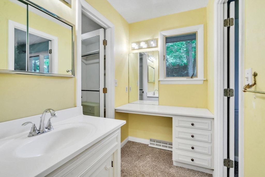 11 Brooks Road Longmeadow, MA 01106 - Photo 24 of 27 a bathroom with a sink and a mirror