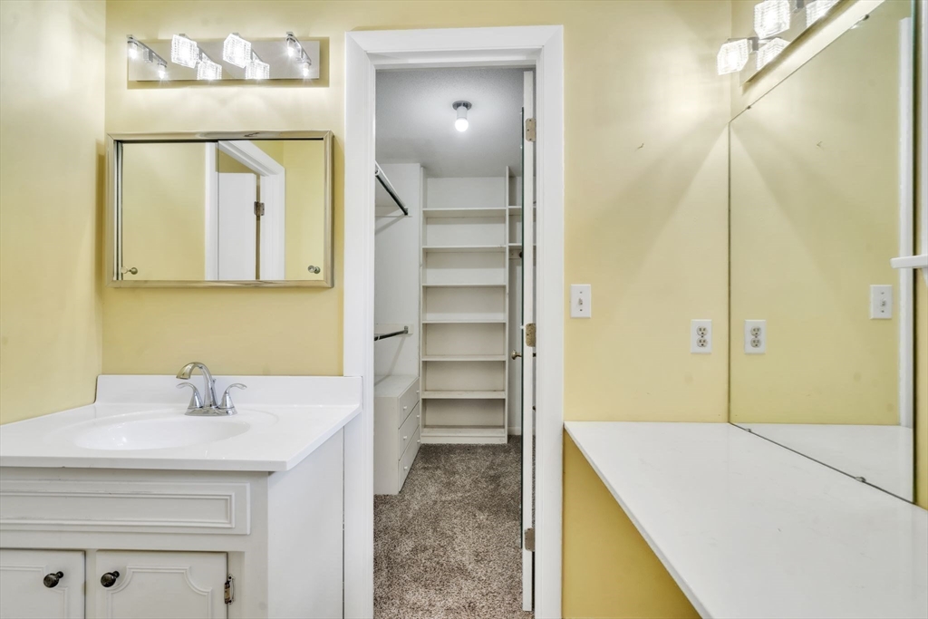 11 Brooks Road Longmeadow, MA 01106 - Photo 25 of 27 a bathroom with a sink and a mirror