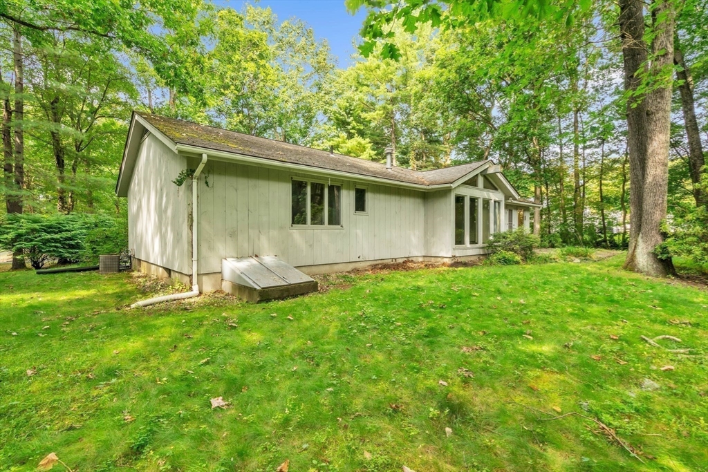11 Brooks Road Longmeadow, MA 01106 - Photo 27 of 27 a backyard of a house with table and chairs