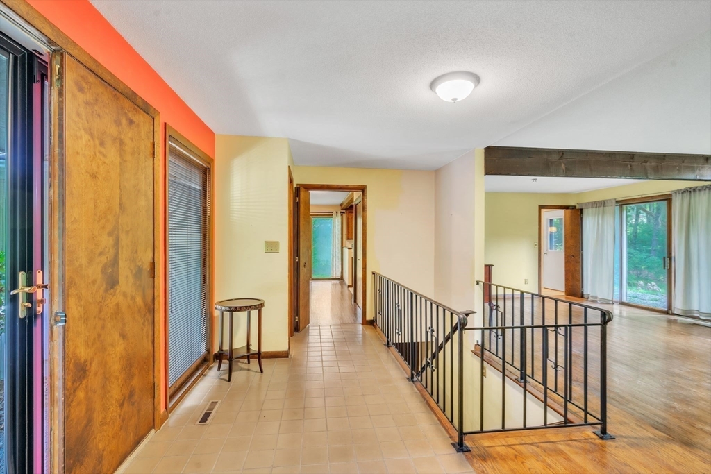 11 Brooks Road Longmeadow, MA 01106 - Photo 7 of 27 a view of a hallway with wooden floor and windows