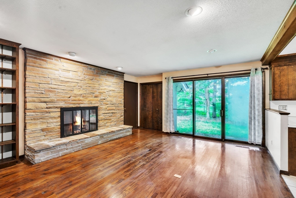 11 Brooks Road Longmeadow, MA 01106 - Photo 9 of 27 a view of an empty room with a fireplace and a window