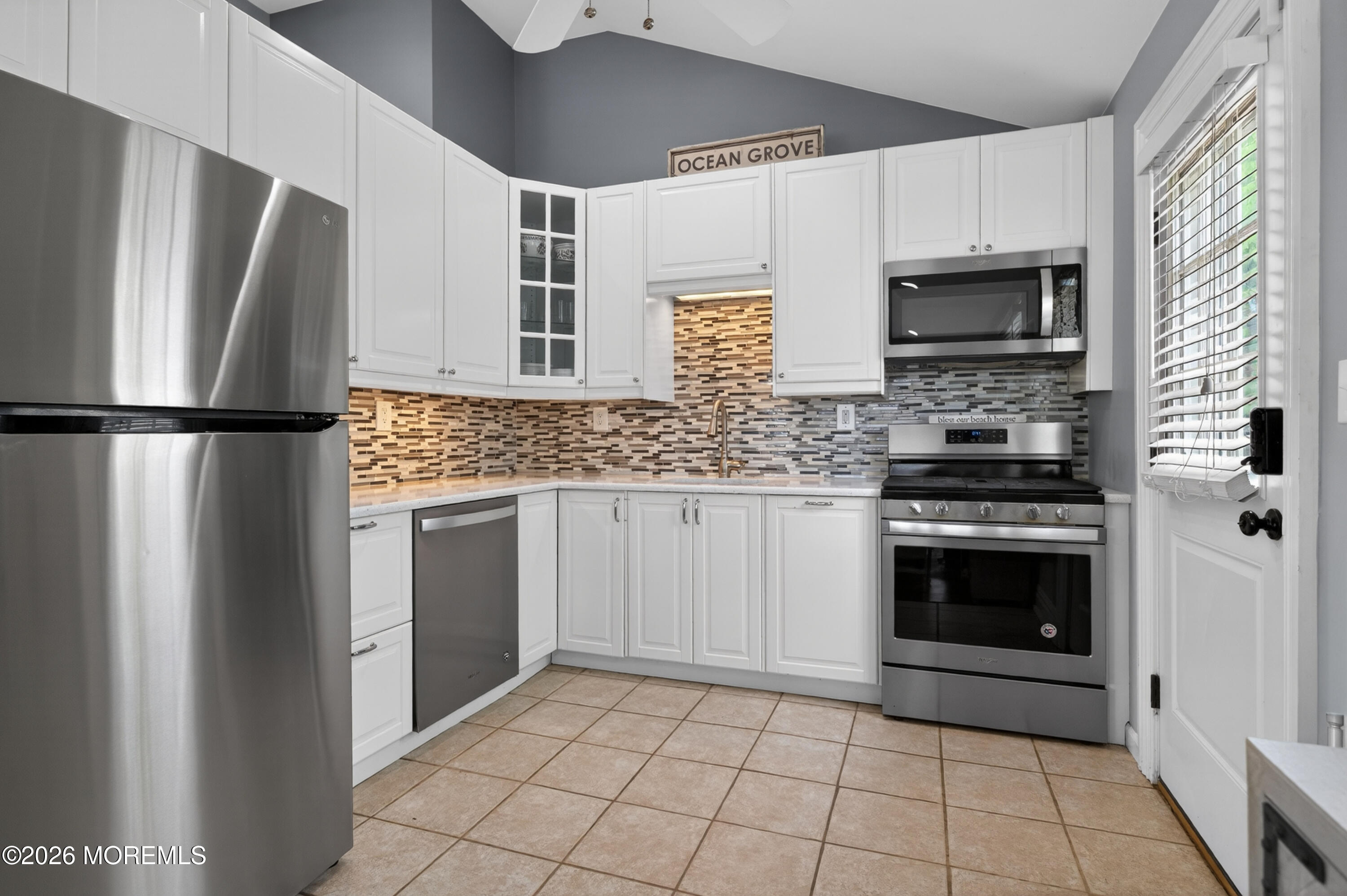 65 Heck Avenue Ocean Grove, NJ 07756 - Photo 17 of 37 a kitchen with stainless steel appliances a refrigerator sink and microwave