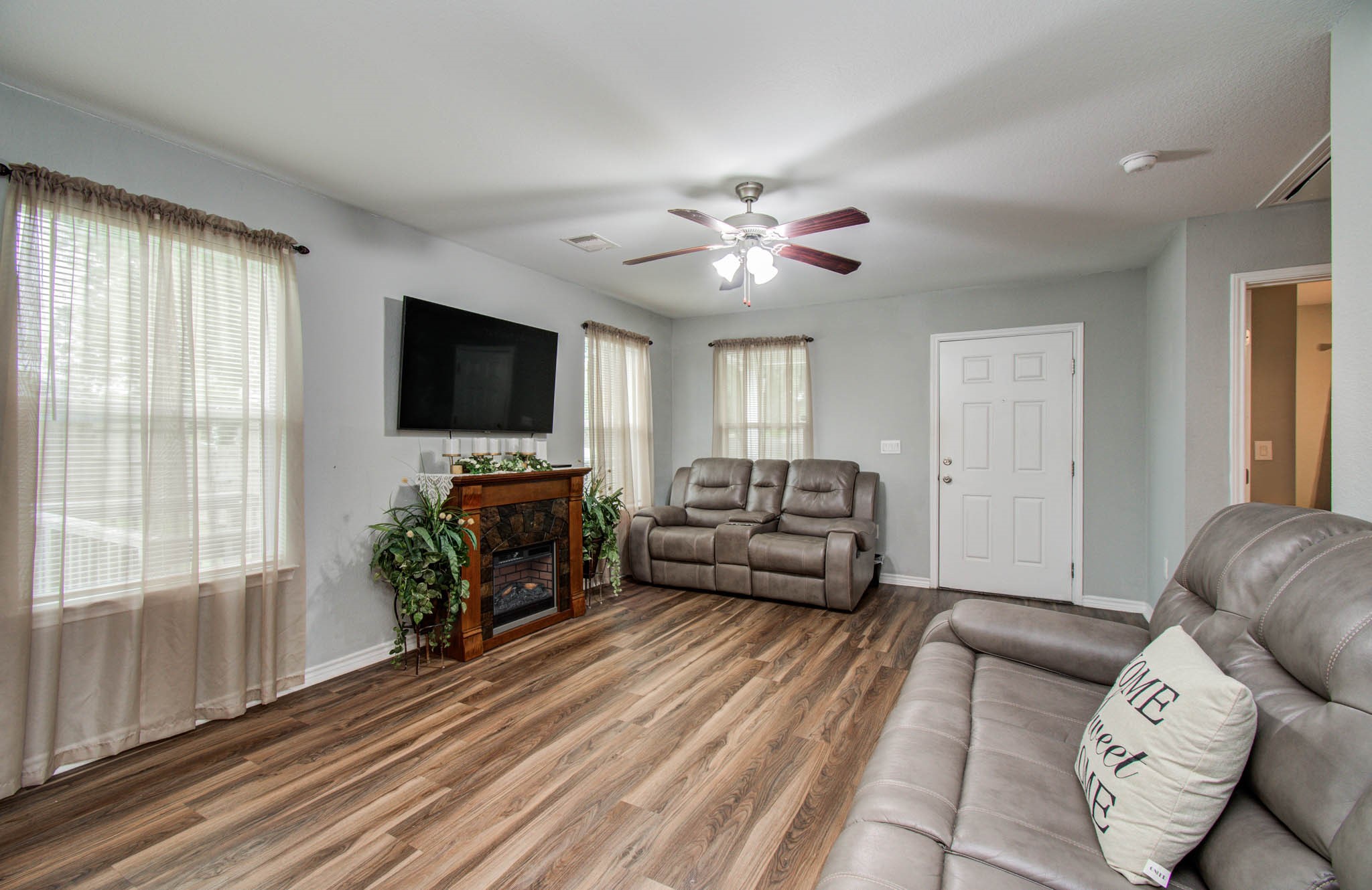 2722 Vega Houston, TX 77088 - Photo 12 of 45 a living room with furniture and a flat screen tv