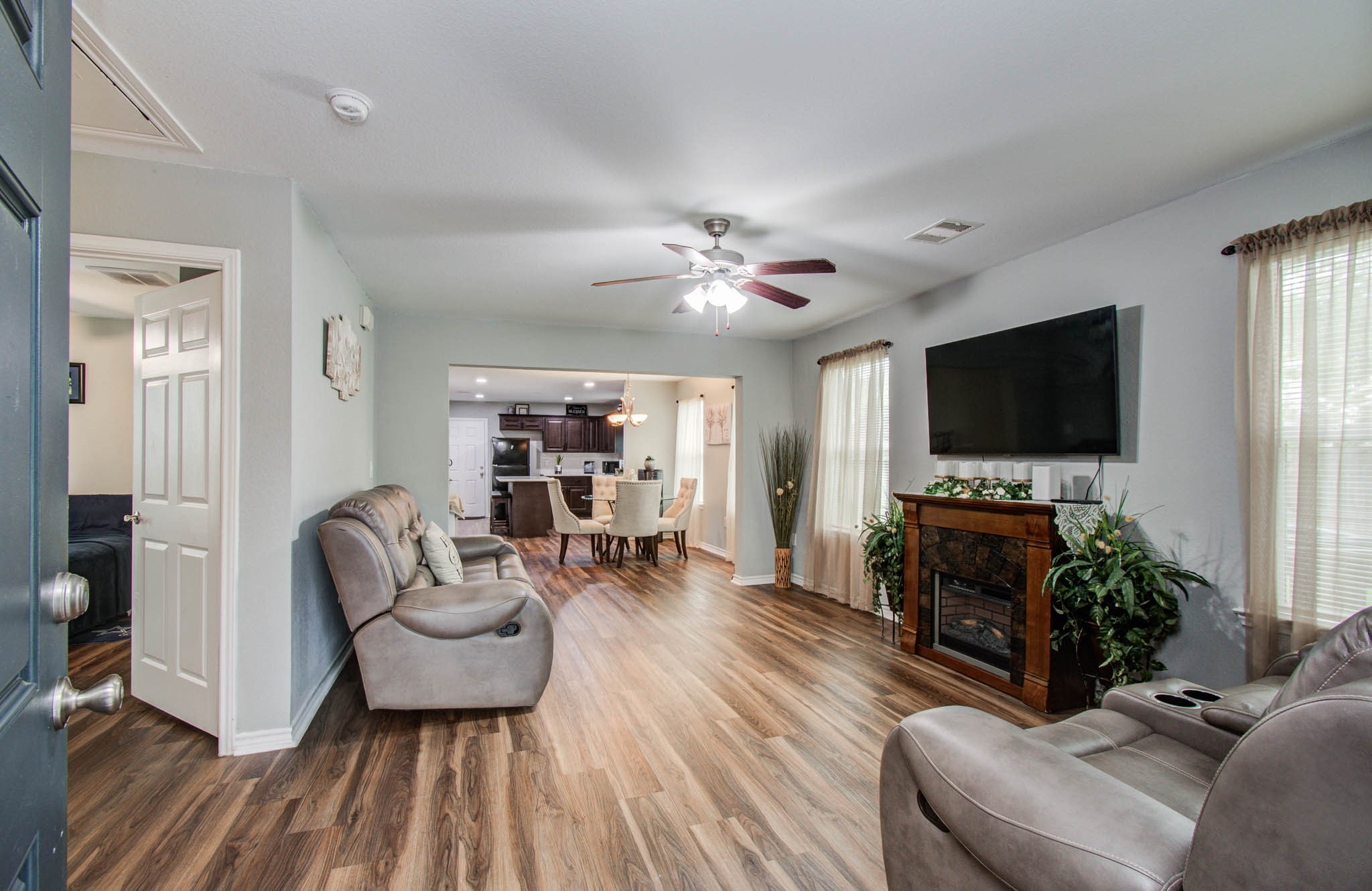 2722 Vega Houston, TX 77088 - Photo 19 of 45 a living room with furniture and a flat screen tv
