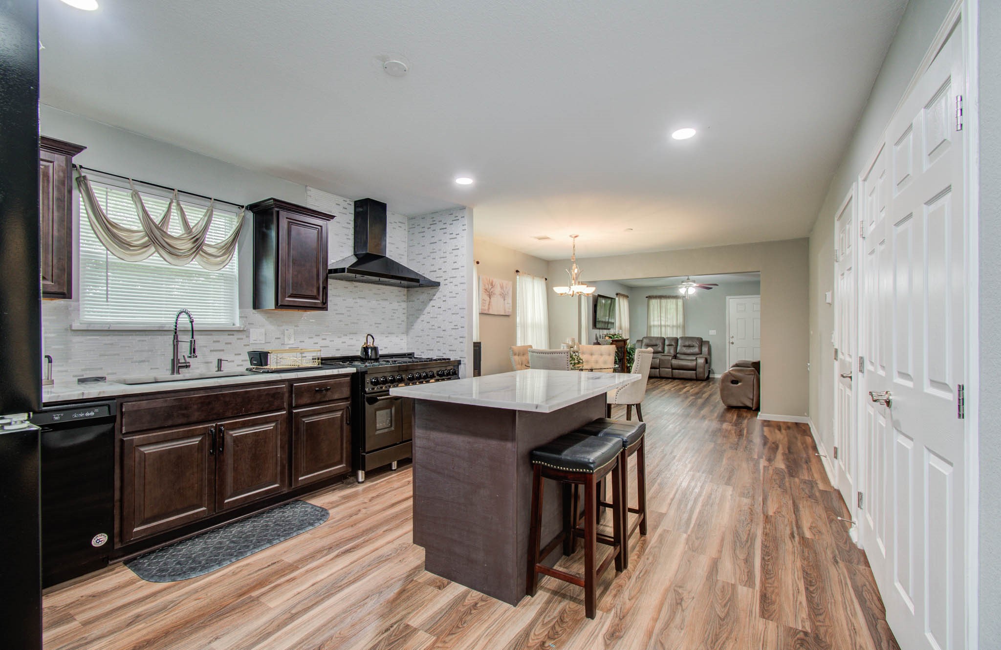 2722 Vega Houston, TX 77088 - Photo 26 of 45 a kitchen with stainless steel appliances granite countertop a sink stove and refrigerator