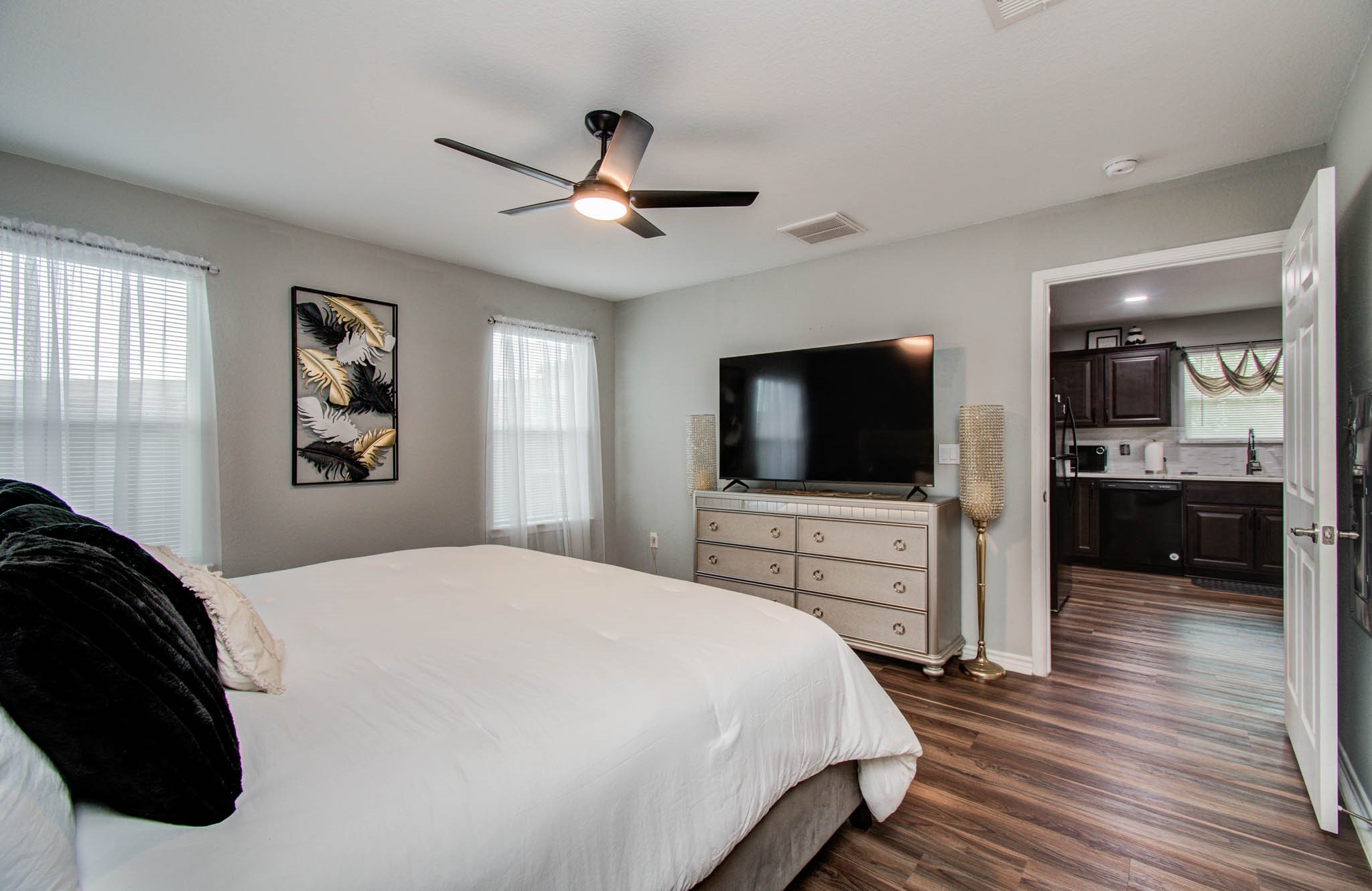 2722 Vega Houston, TX 77088 - Photo 29 of 45 a bedroom with a bed and a flat screen tv