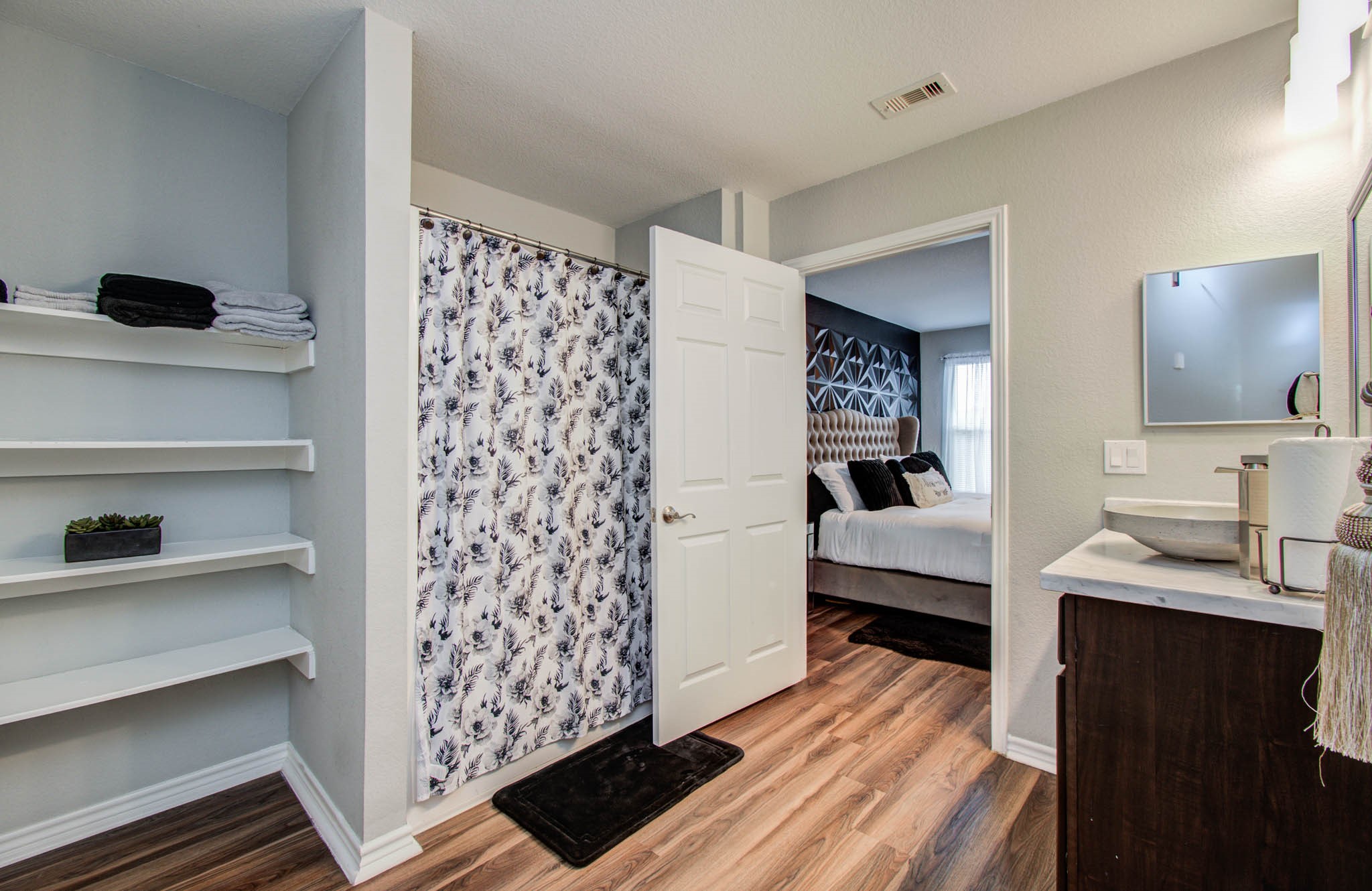 2722 Vega Houston, TX 77088 - Photo 31 of 45 a bedroom with a bed and a view of bathroom