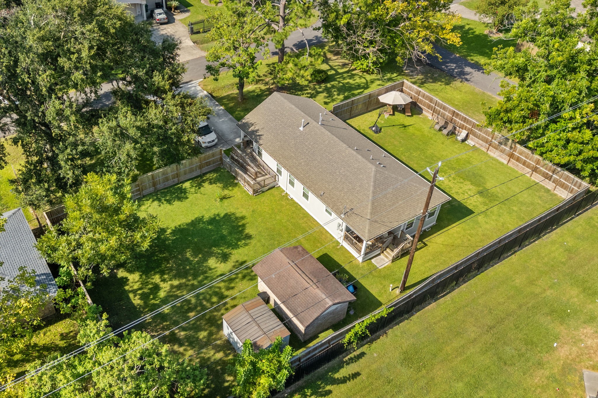 2722 Vega Houston, TX 77088 - Photo 36 of 45 an aerial view of a house with a yard and large trees
