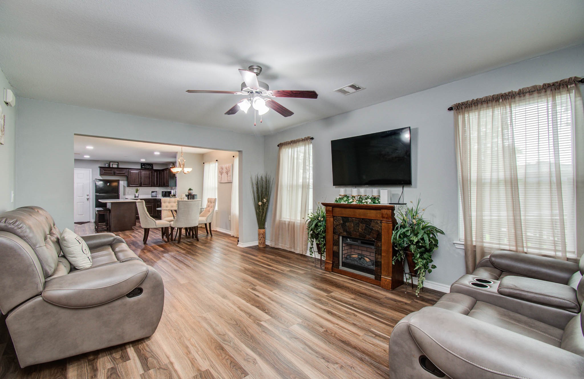 2722 Vega Houston, TX 77088 - Photo 10 of 45 a living room with furniture and a flat screen tv