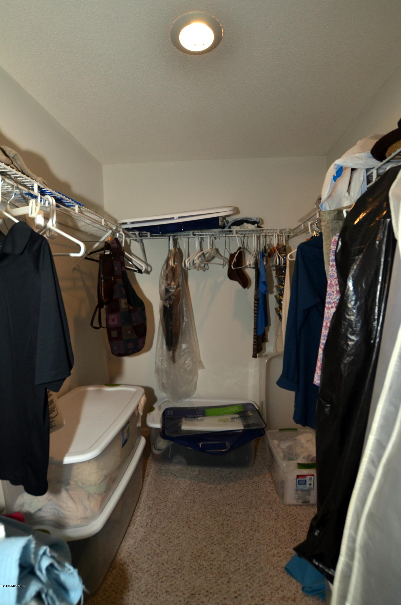 982 Fred Snow Road Becket, MA 01223 - Photo 15 of 21 a view of walk in closet with clothes and shoes