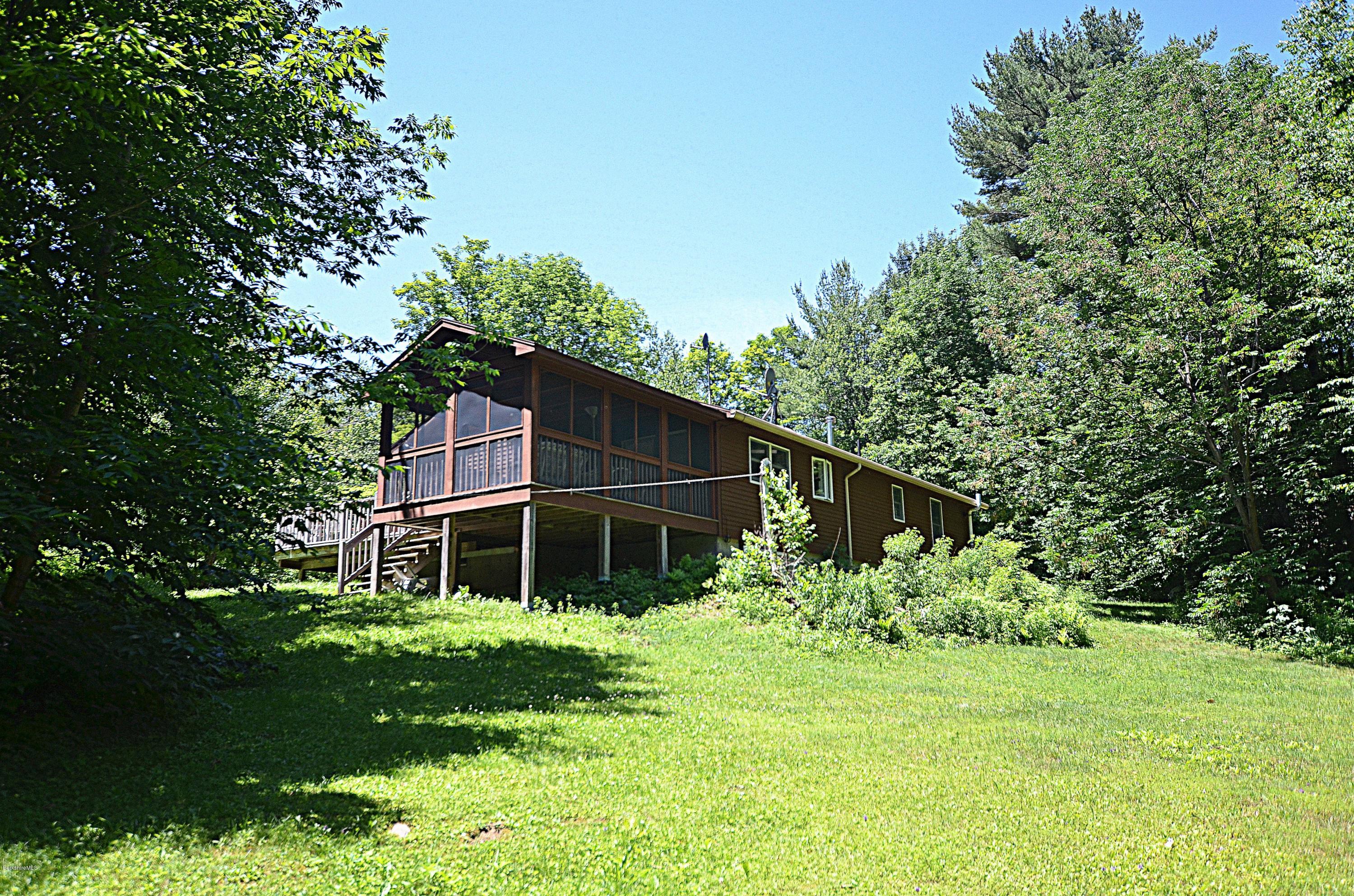 982 Fred Snow Road Becket, MA 01223 - Photo 3 of 21 a house with trees in the background