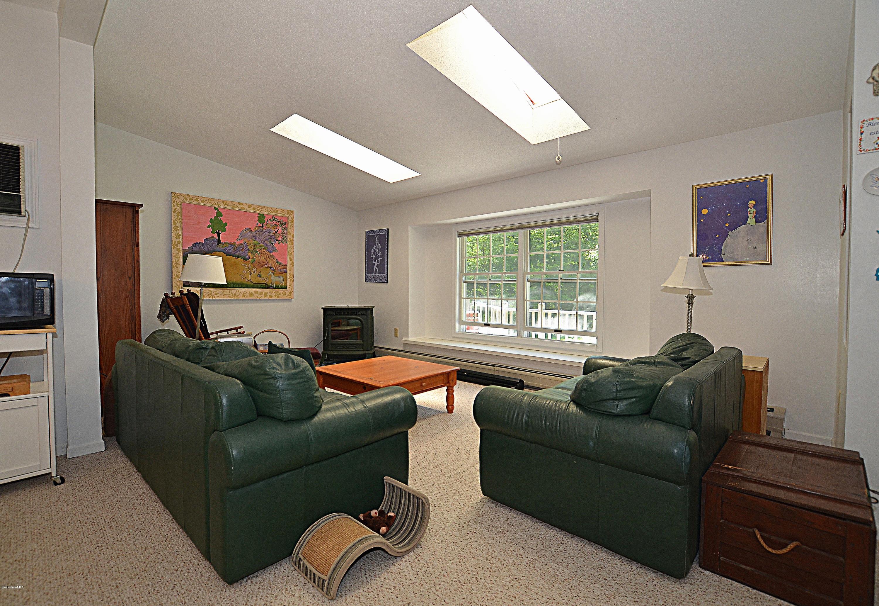 982 Fred Snow Road Becket, MA 01223 - Photo 4 of 21 a living room with furniture and a window