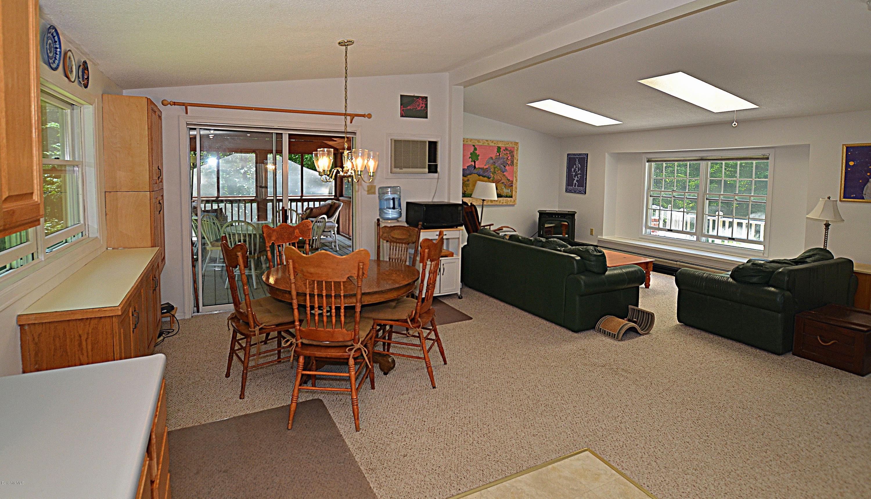 982 Fred Snow Road Becket, MA 01223 - Photo 6 of 21 a living room with furniture and a flat screen tv