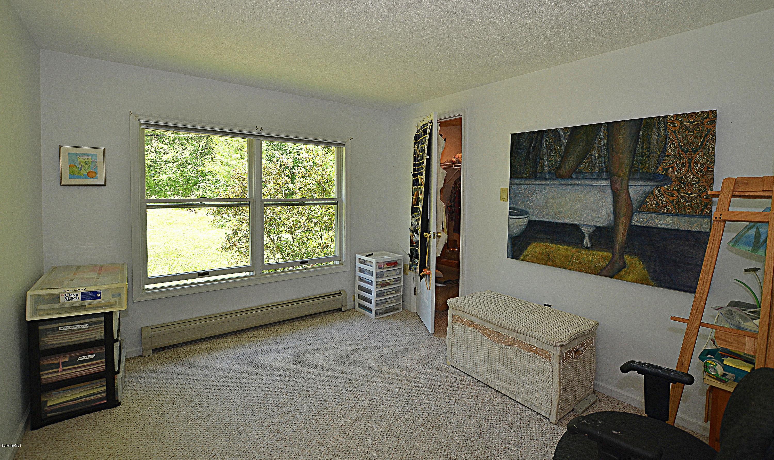 982 Fred Snow Road Becket, MA 01223 - Photo 10 of 21 a view of room with window and a flat screen tv