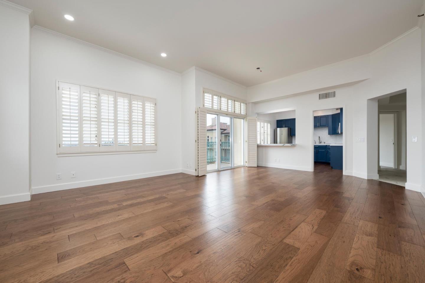 1 Baldwin Avenue, Unit 1017 San Mateo, CA 94401 - Photo 3 of 8 a view of empty room with wooden floor and windows