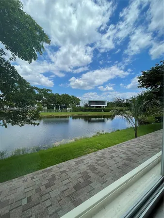 a view of a lake with a big yard
