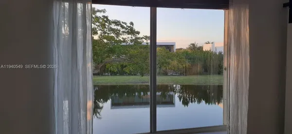 a view of a glass door and a porch