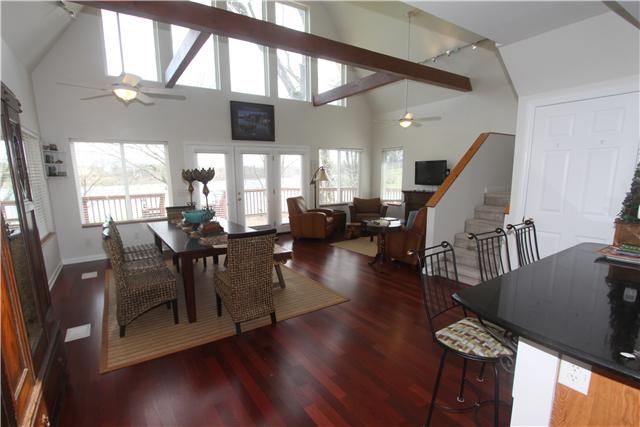 4311 Cairo Bend Road Lebanon, TN 37087 - Photo 19 of 20 Another view of the open airy floor plan with soaring ceilings, beautiful wooden beams give it just the right look being surround by picture windows.