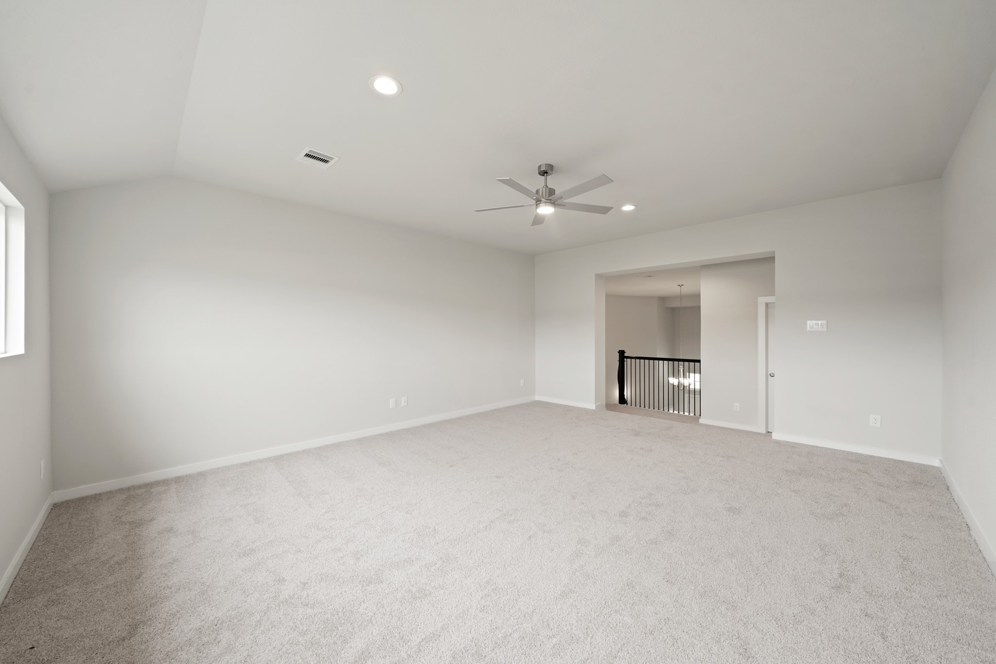 3319 Pin Cherry Lane Conroe, TX 77301 - Photo 19 of 30 a view of an empty room with a chandelier fan