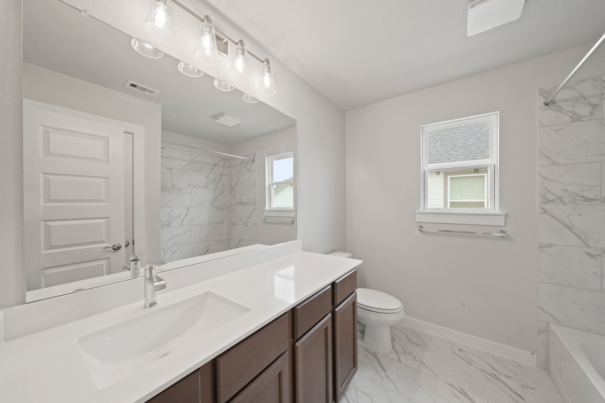 3319 Pin Cherry Lane Conroe, TX 77301 - Photo 21 of 30 a bathroom with a sink a toilet and shower