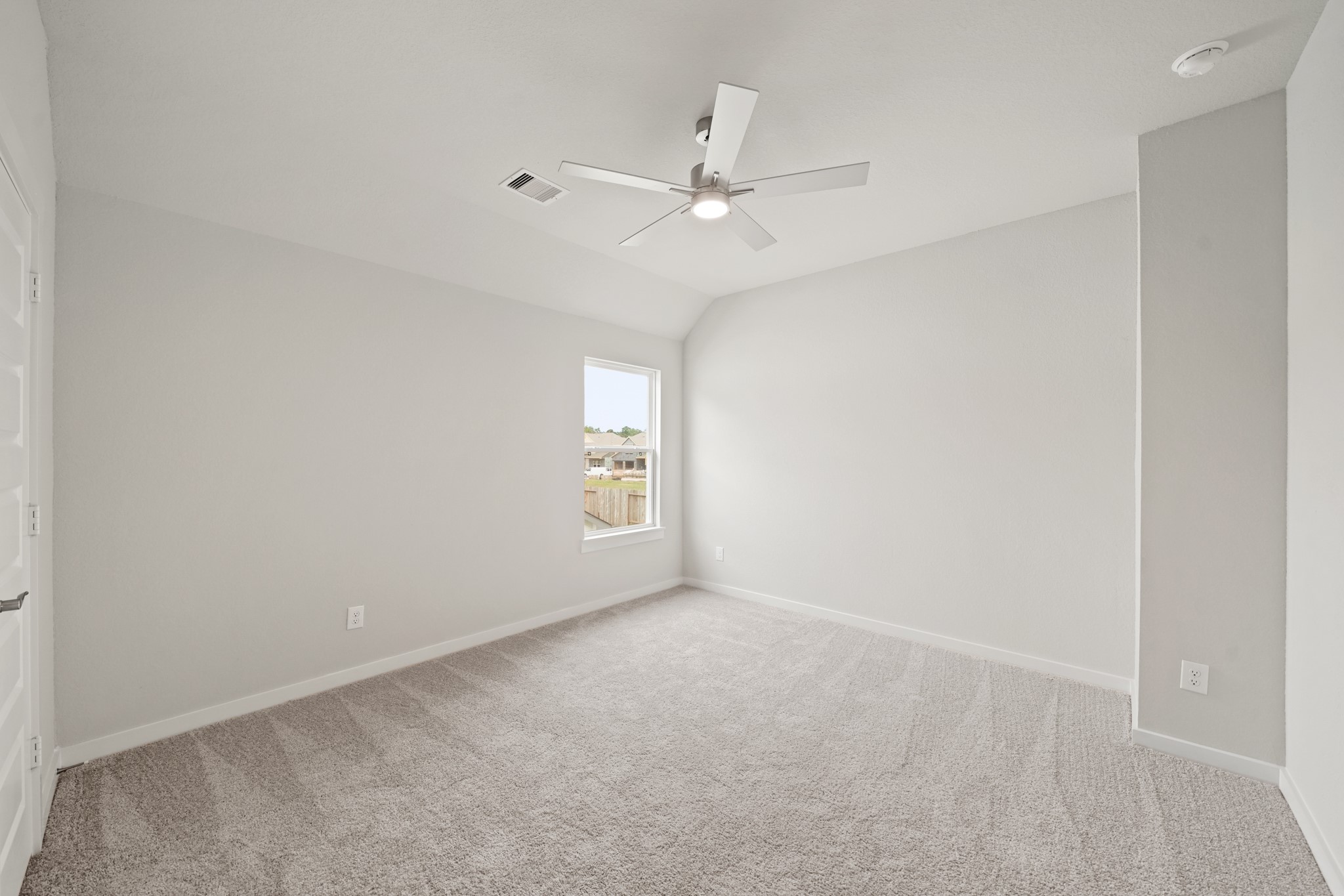 3319 Pin Cherry Lane Conroe, TX 77301 - Photo 22 of 30 a view of an empty room with a window