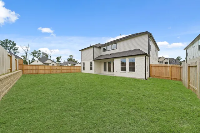 a backyard of a house with lots of green space