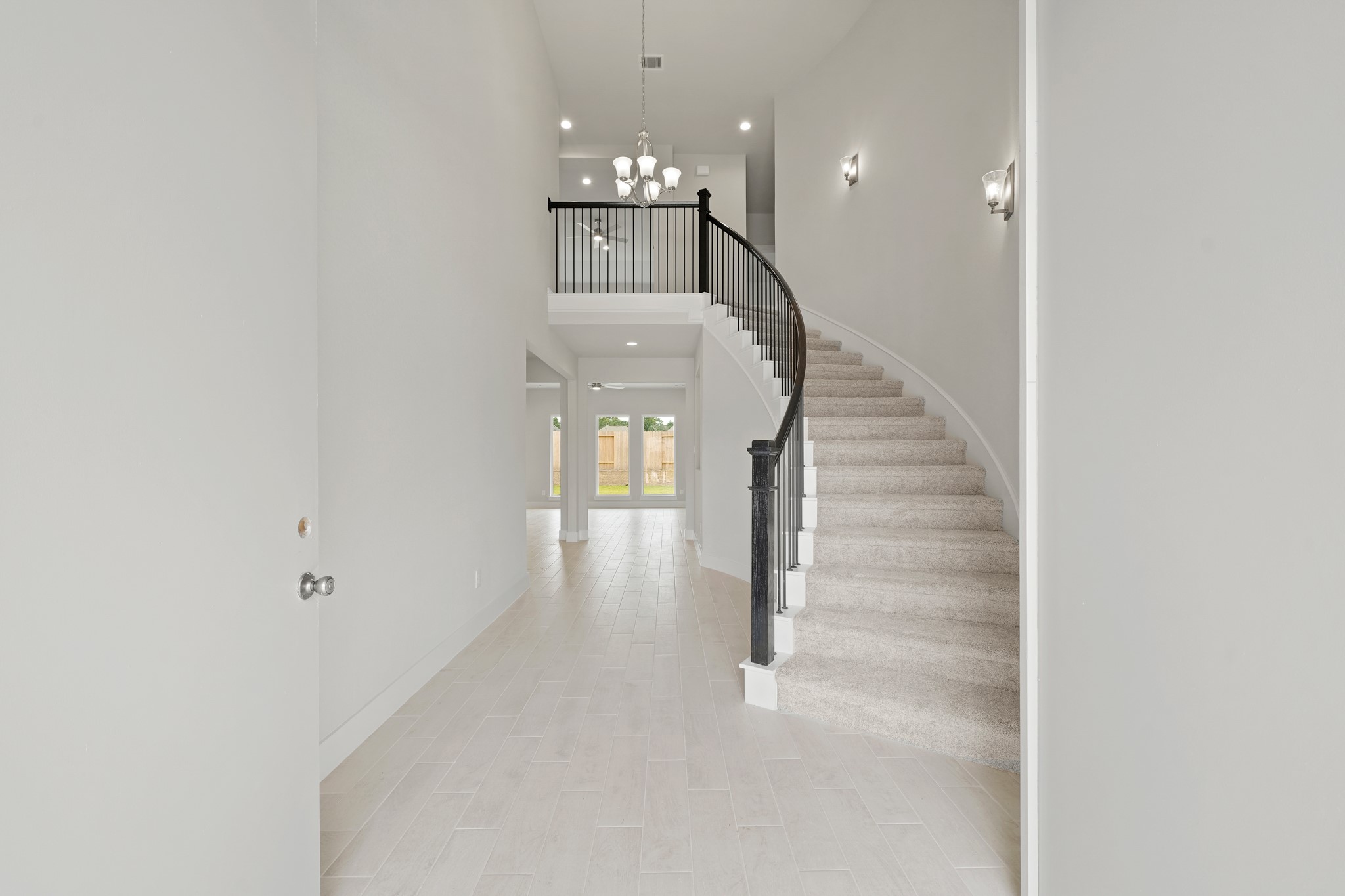 3319 Pin Cherry Lane Conroe, TX 77301 - Photo 4 of 30 a view of a hallway with stairs