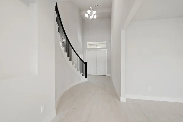 a view of a livingroom with stairs