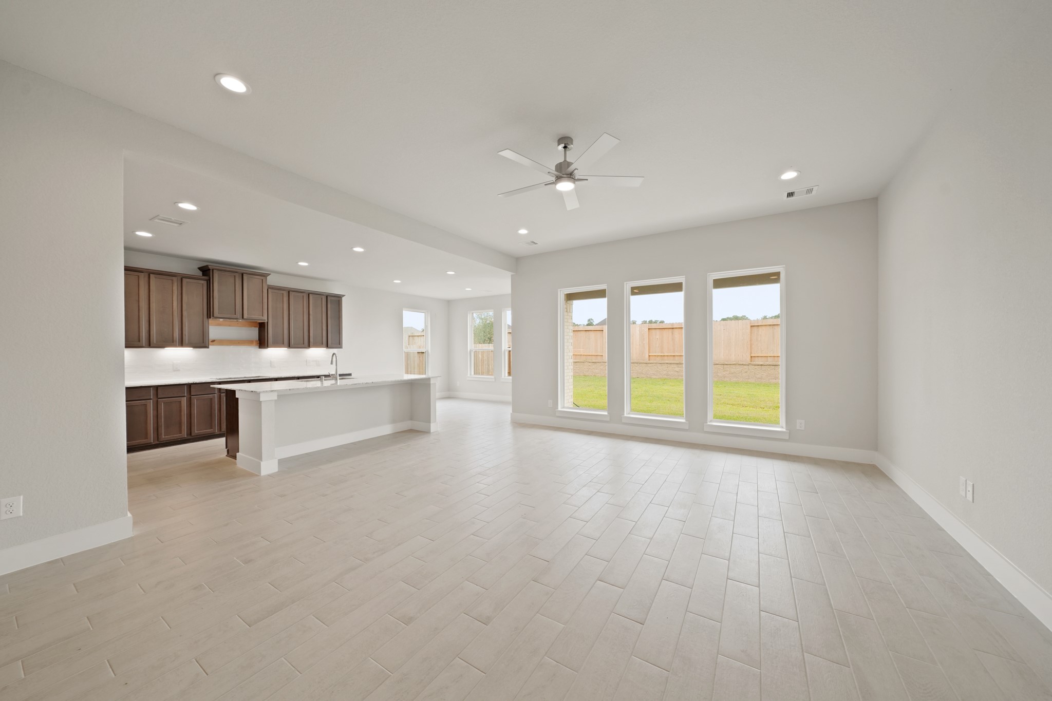 3319 Pin Cherry Lane Conroe, TX 77301 - Photo 9 of 30 a view of an empty room with a kitchen stove and a window