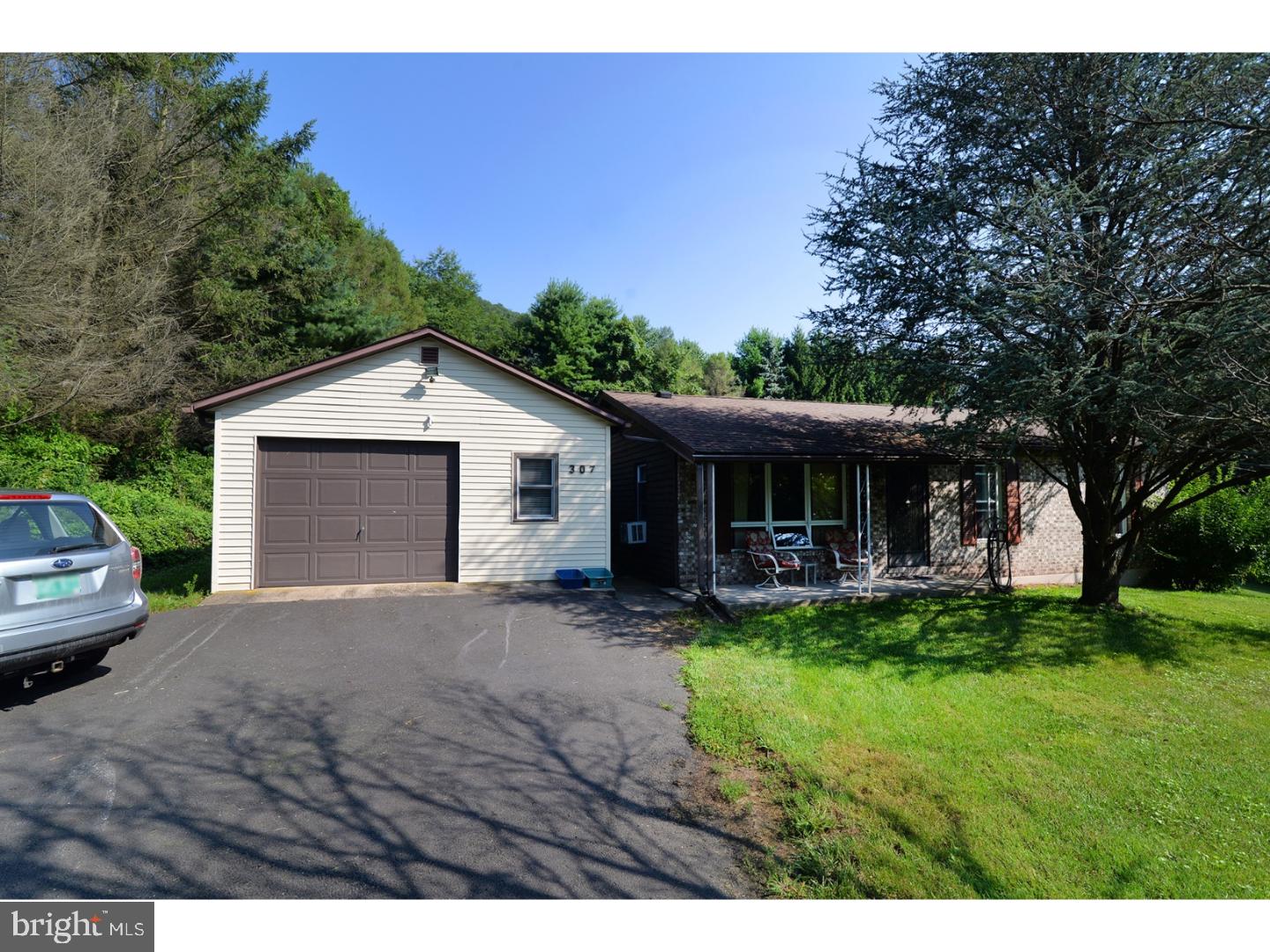 307 Germanville Road Ashland, PA 17921 - Photo 1 of 24 a view of a house with a yard and sitting area
