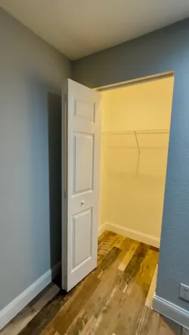 a bathroom with a sink mirror and toilet