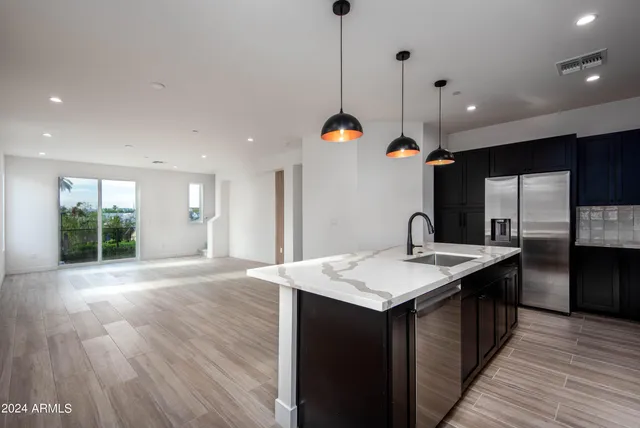 a kitchen with a sink and a window