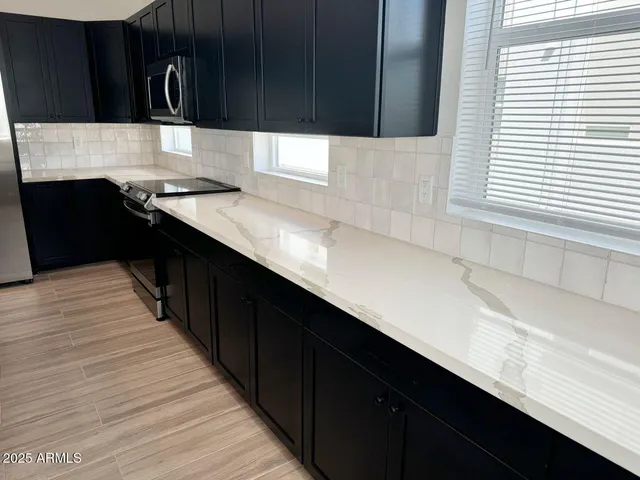 a white refrigerator freezer sitting in a kitchen