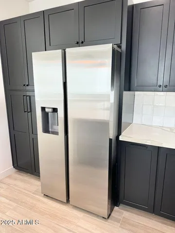a kitchen with a sink a counter and cabinets