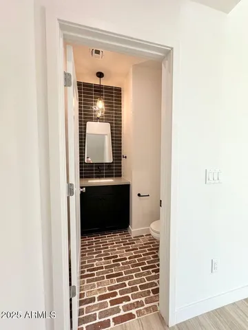 a bathroom with a toilet and a sink