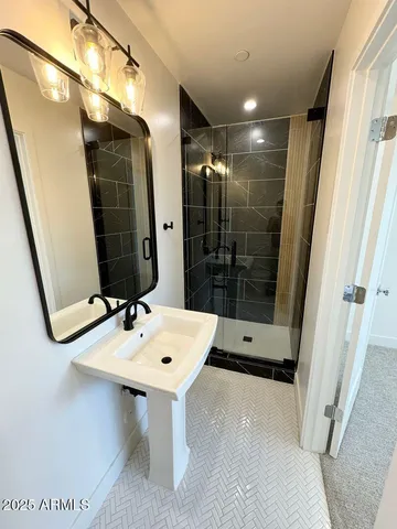 a view of kitchen with stainless steel appliances granite countertop a refrigerator and a sink